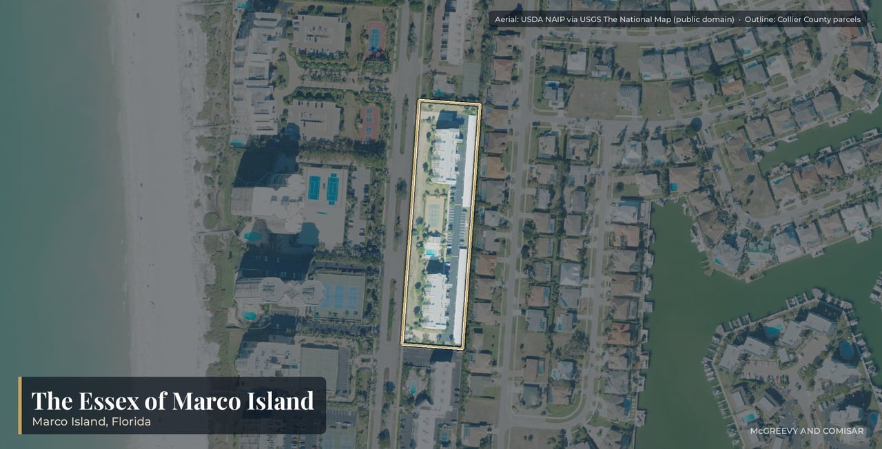 Aerial view of The Essex of Marco Island, Florida, the two five-story condominium buildings at 801 and 861 South Collier Boulevard, across the road from the beach