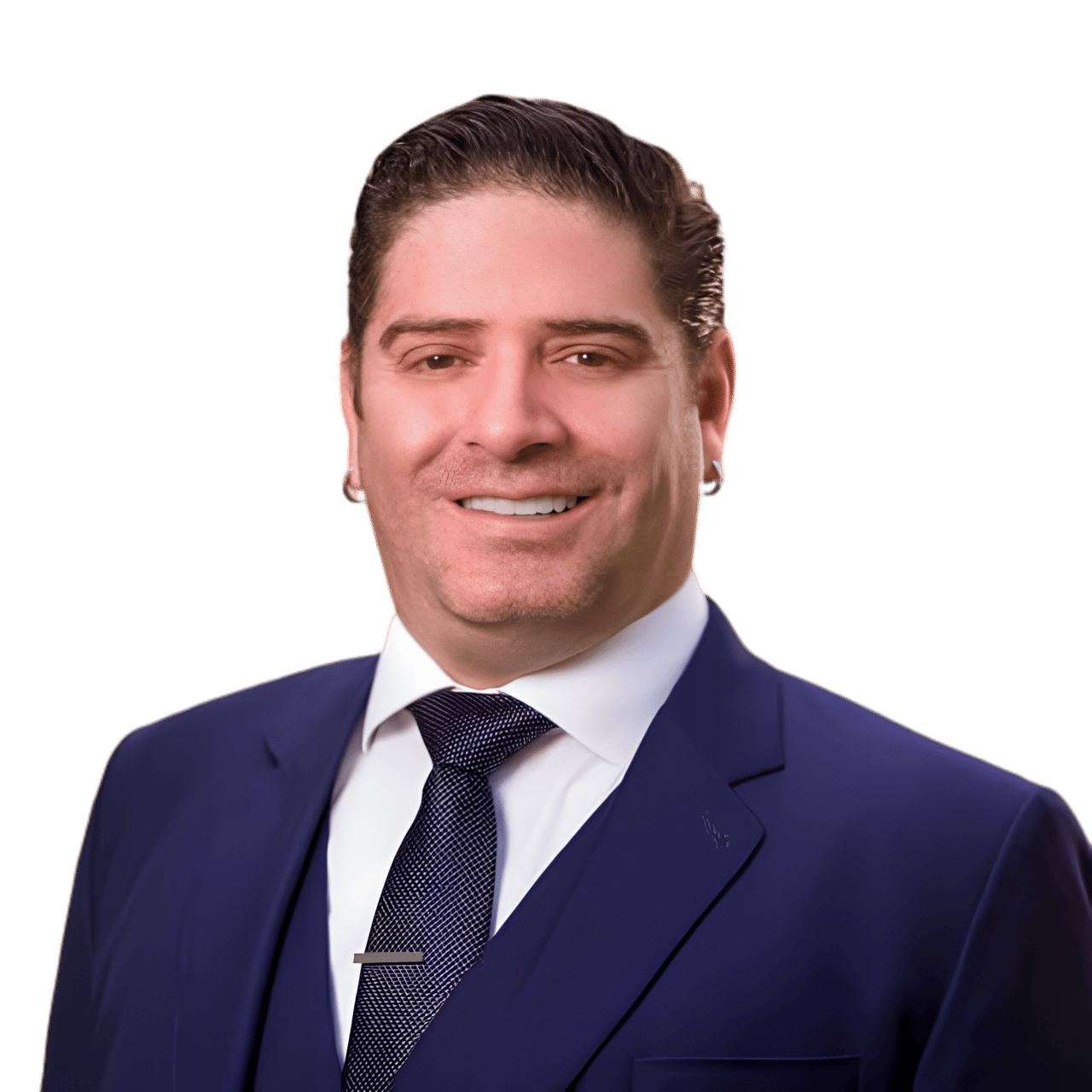 Luis Gallego, smiling in a navy suit and patterned tie.