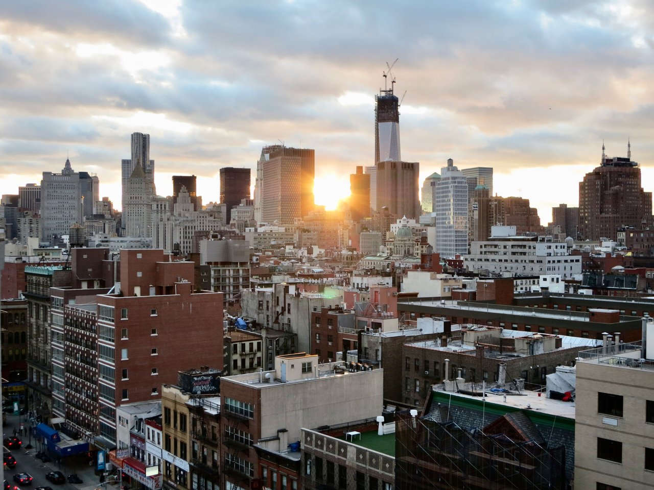 The Bowery in Manhattan's Lower East Side, featuring nineteenth-century masonry commercial buildings, historic financial institutions, traditional storefronts, and contemporary architecture along one of New York City's oldest thoroughfares.
