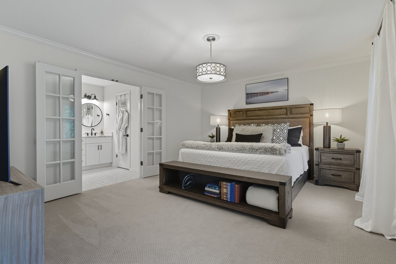 photo of a luxury primary bedroom