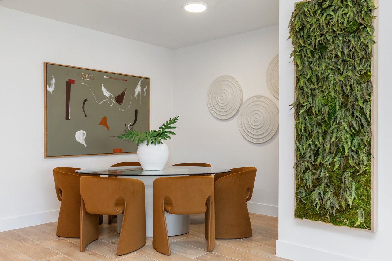 Arbor Coconut Grove residence dining area beside a planted feature wall