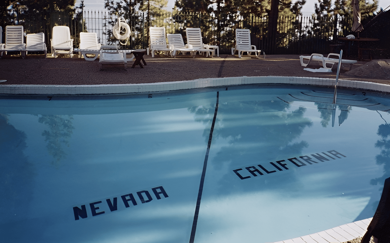 Cal Neva pool with Nevada and California marked on opposite sides of the state line.