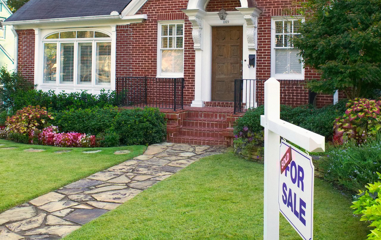 Denver home with for sale sign covered by sold sign showing typical home selling timeline in 2026