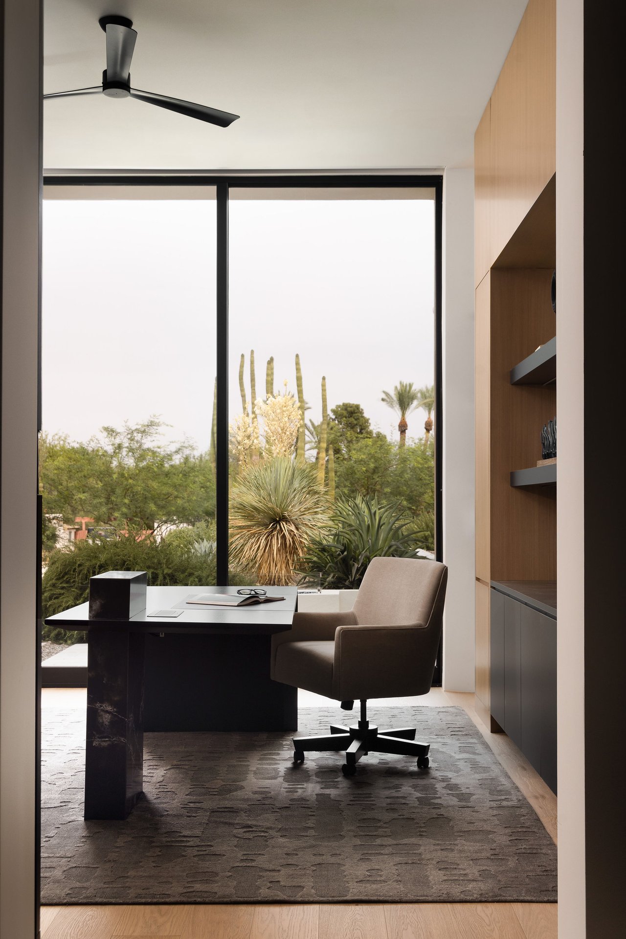 Modern luxury home in Paradise Valley with resort-style backyard, pool, fire feature, and contemporary architecture at sunset.