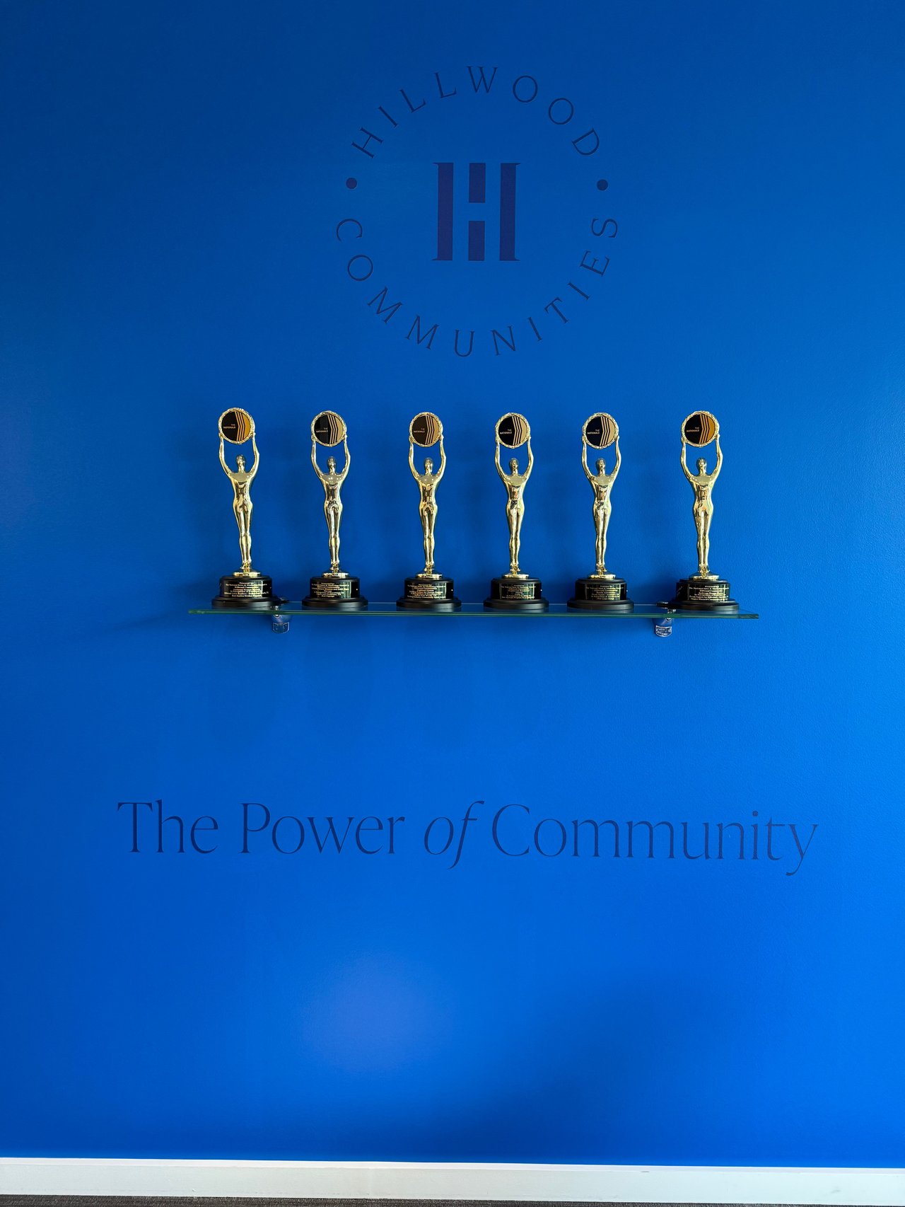 McSAM Awards 2025 display at Hillwood Communities headquarters Turtle Creek Dallas fourth consecutive Developer of Year trophy