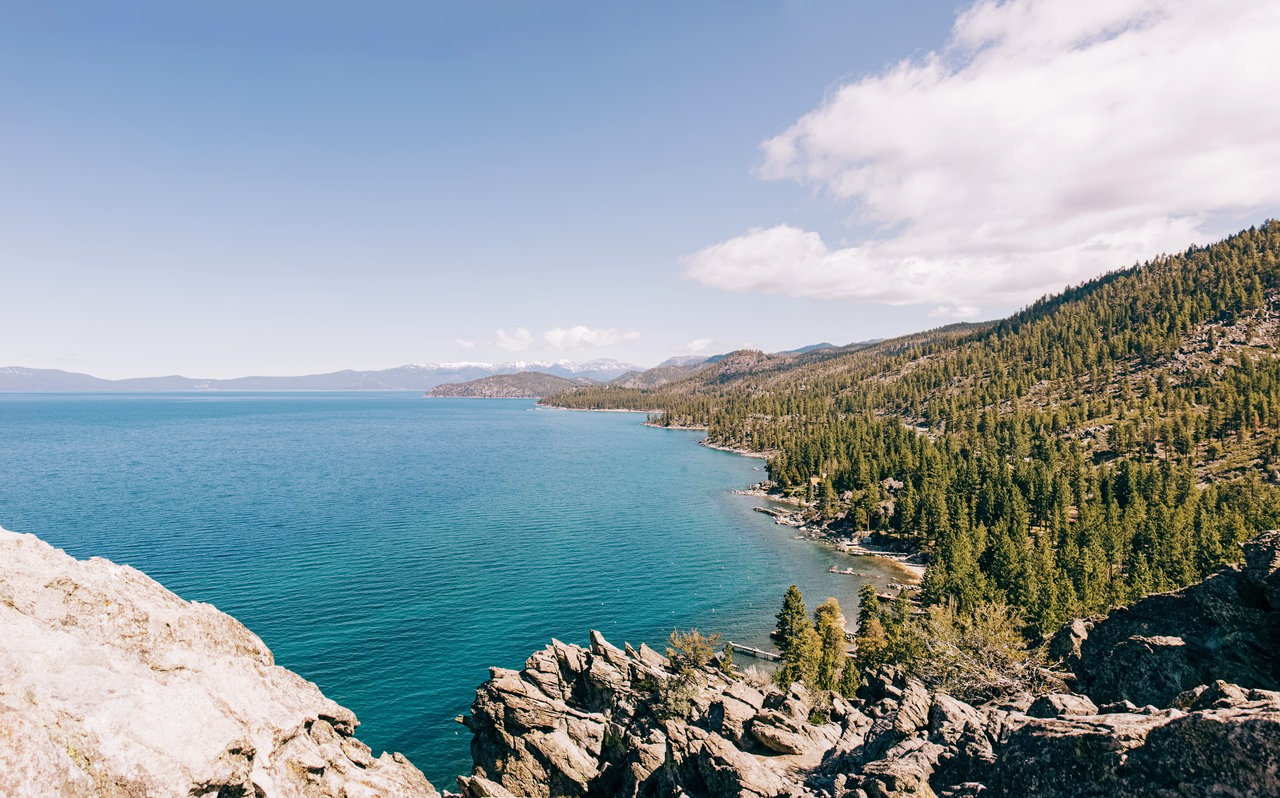 Lakefront home in Incline Village with Lake Tahoe and mountain views, illustrating how TRPA buildable coverage affects Incline Village homes for sale.