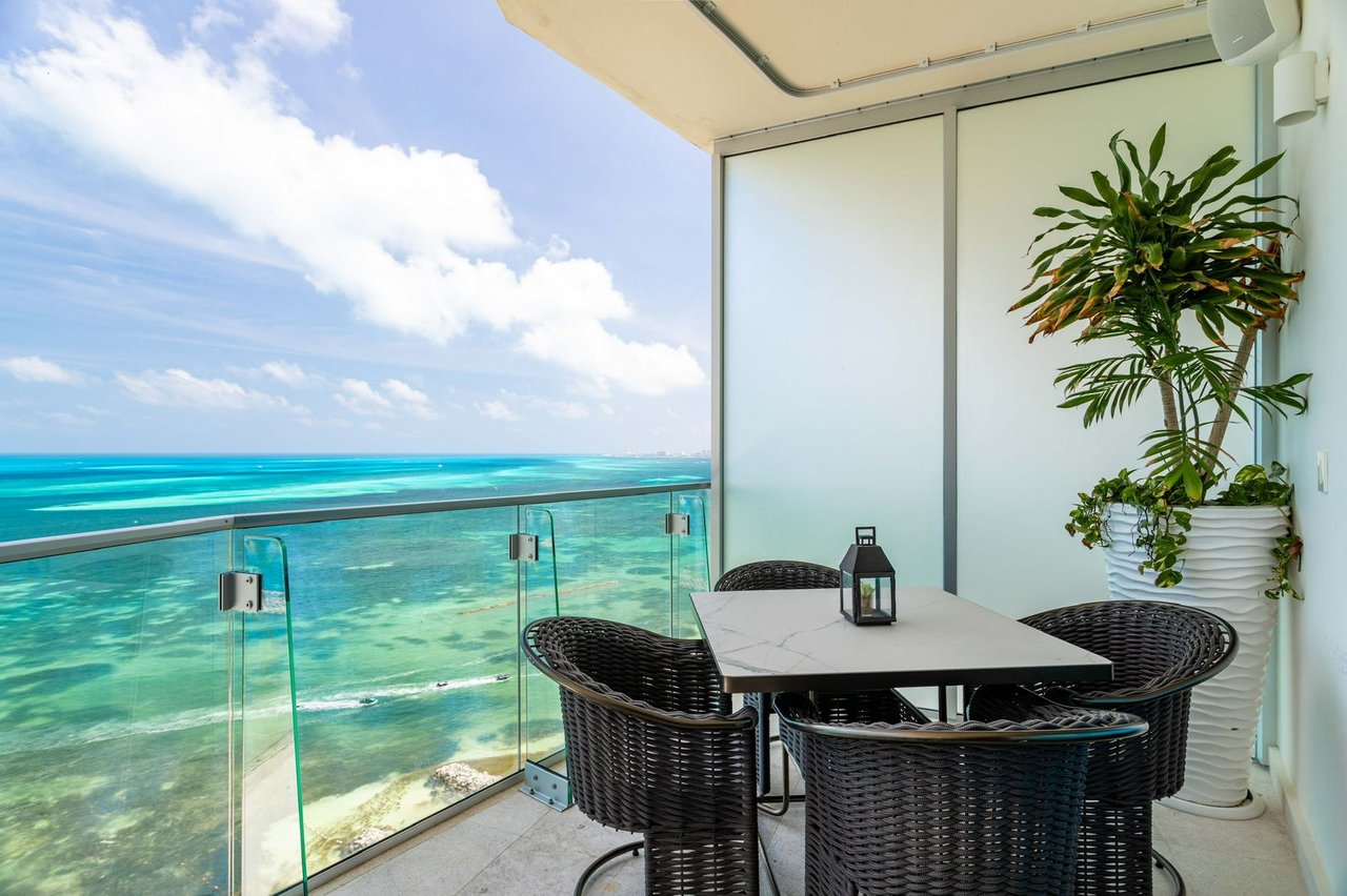 LUXURIOUS and STUNNING apartment featuring OCEAN VIEWS from the living room, primary bedroom, and terrace, with BEACHFRONT access in Cancun's most upscale area