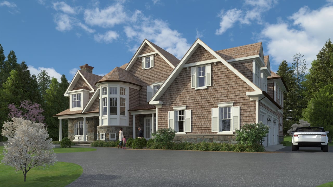 Shingle-sided home with multiple gables, a projecting bay window, and a broad driveway.