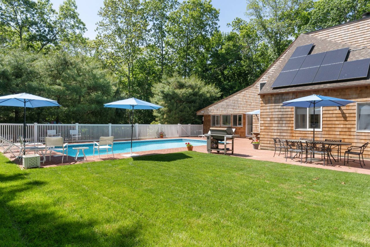 INVITING YEAR-ROUND OR SEASONAL RETREAT WITH HEATED POOL