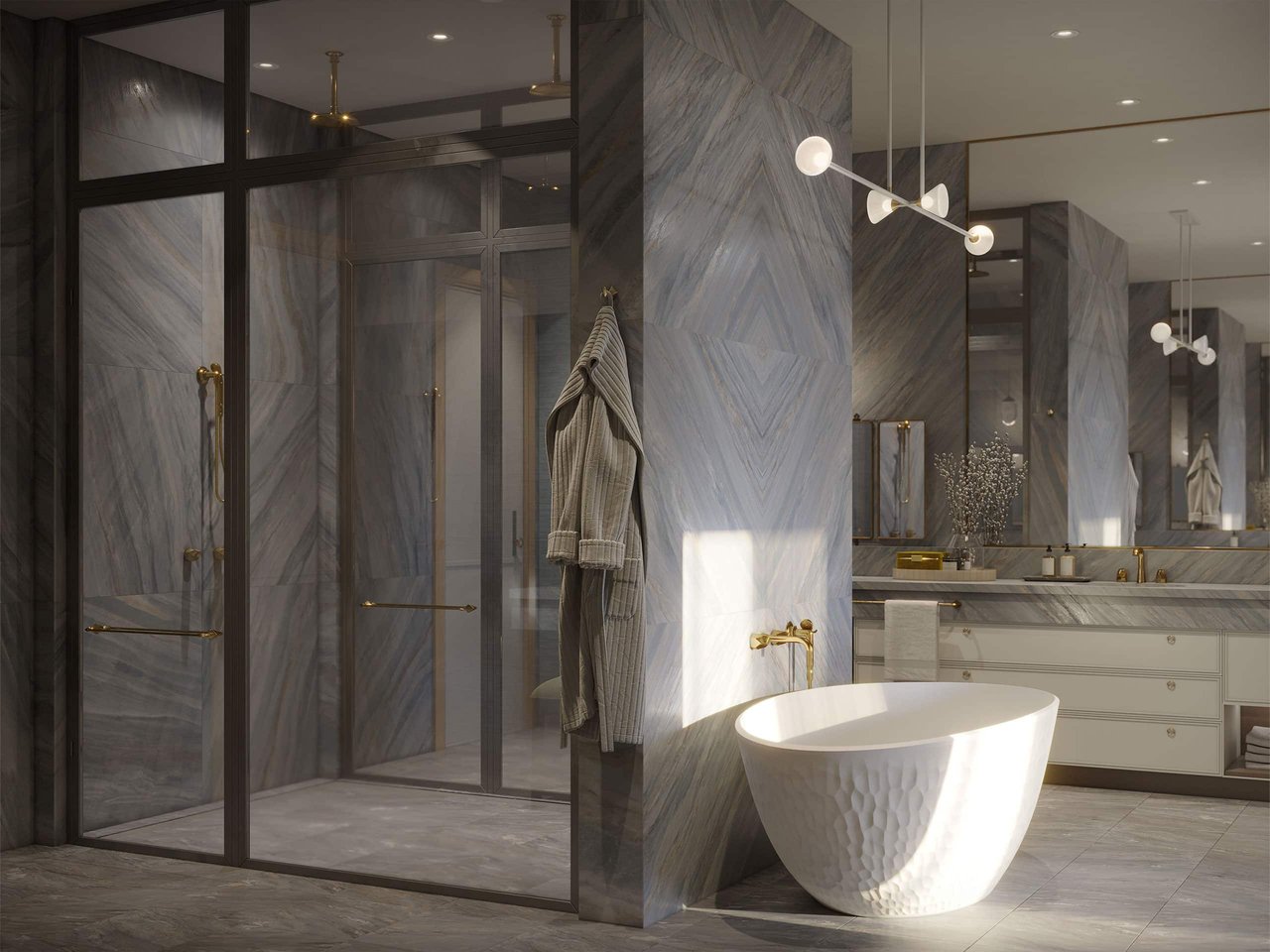 Marble bathroom with a glass shower, sculptural freestanding tub, and brass fixtures.