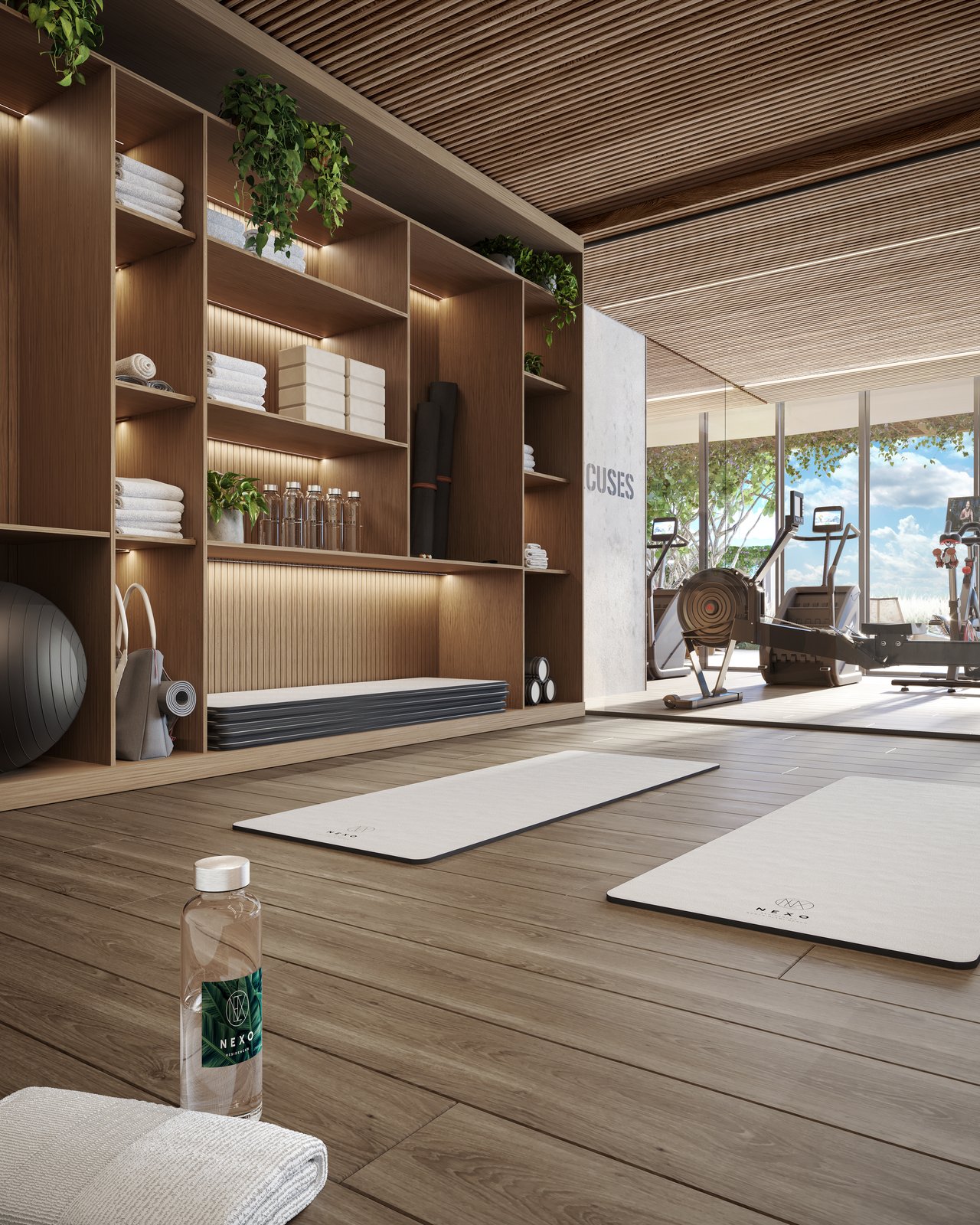 NEXO Residences fitness room with yoga mats, wooden shelving, and exercise equipment by the windows.