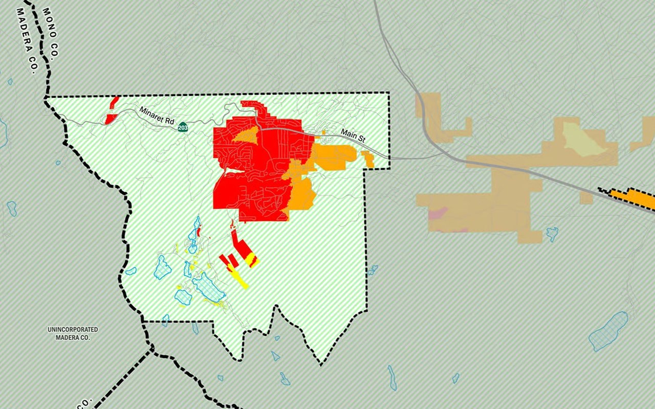 Fire hazard map with red and orange zones around town, labeled Main Street and Minaret Road.
