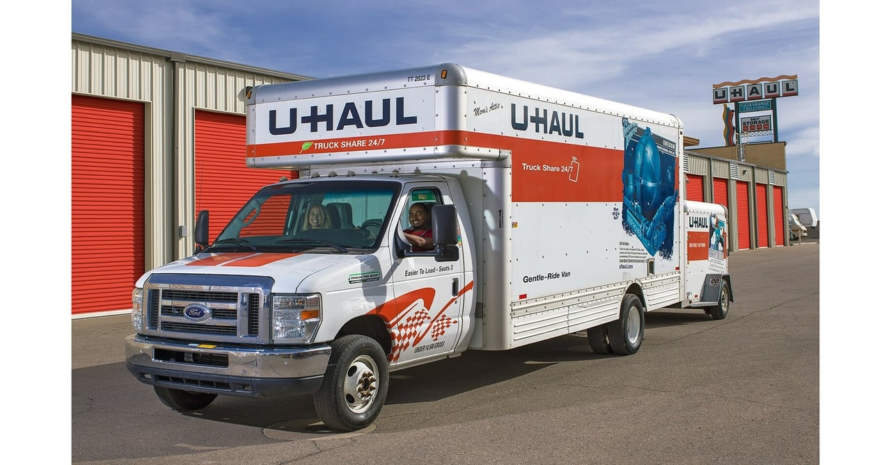 U Haul truck sitting in a U Haul dealer being picked up by a couple