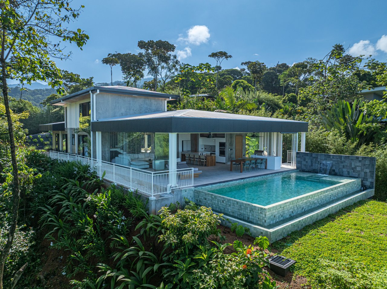 New contemporary tropical villa boasts with a movie theater and views of the iconic whale’s tail
