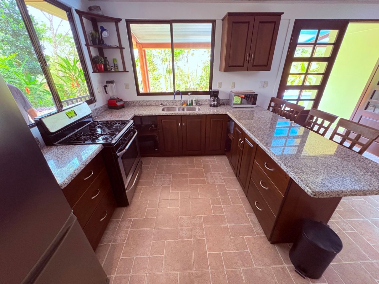 Move in ready 2 bedroom / 2 bathroom home with window ocean view and pool in Ojochal.
