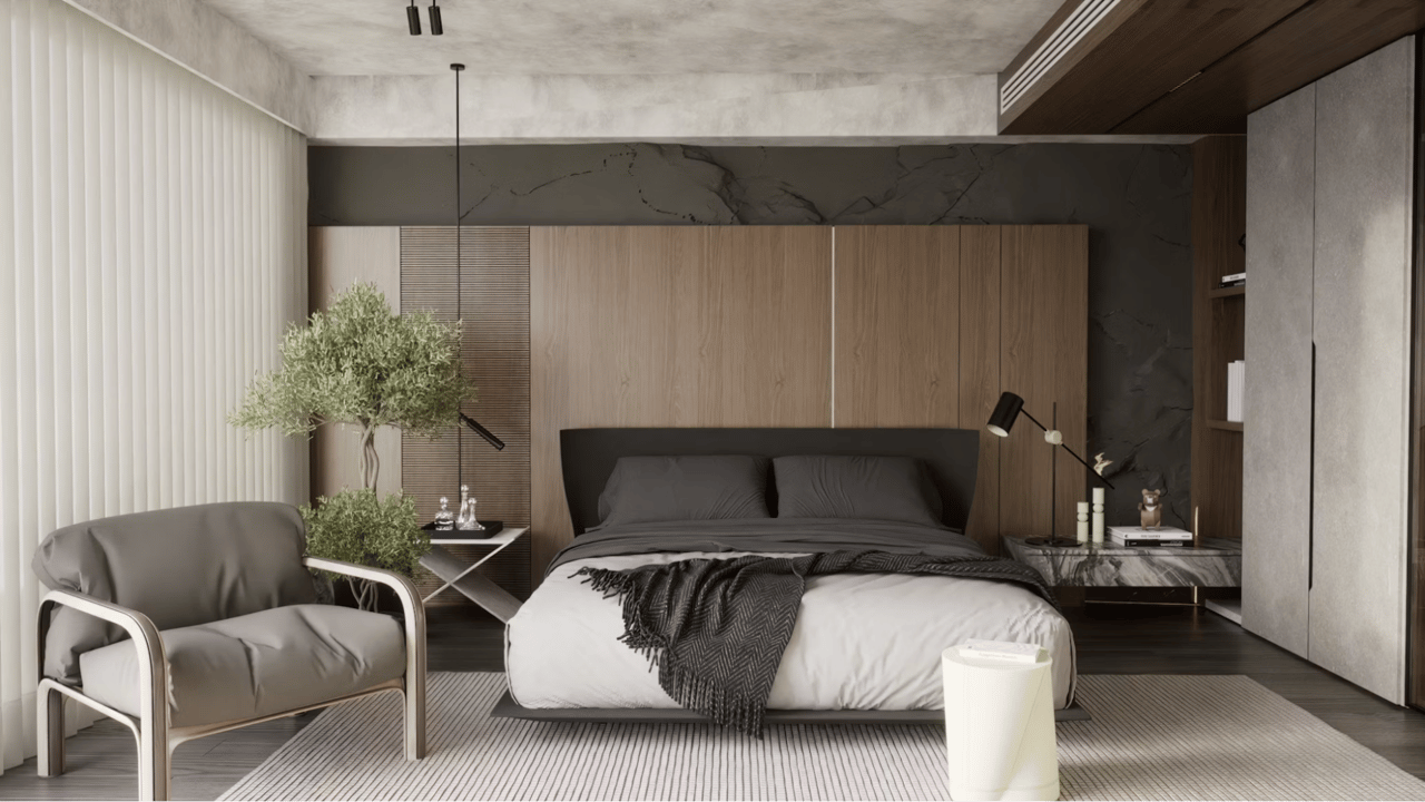 Modern bedroom with a low bed, wood-paneled wall, gray chair, and striped rug.