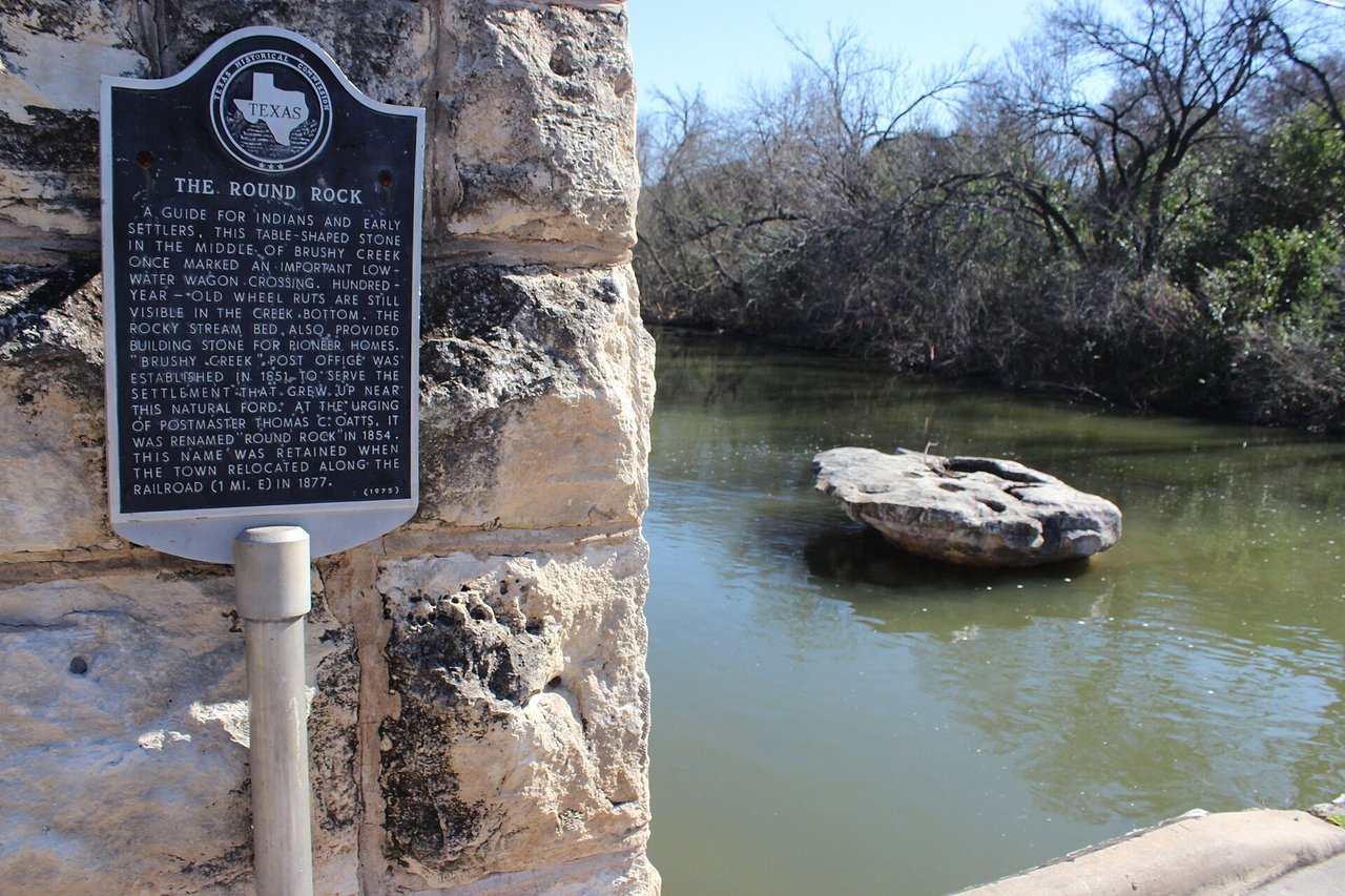 The namesake round rock in Brushy Creek with its Texas historical marker, Round Rock, TX