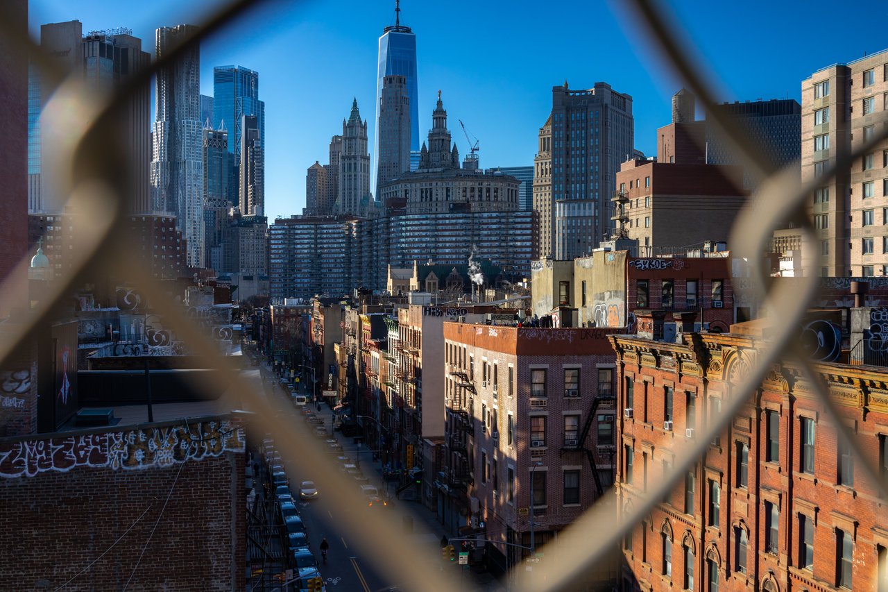 Historic brick tenement buildings and commercial storefronts along Hester Street in the Lower East Side, Manhattan