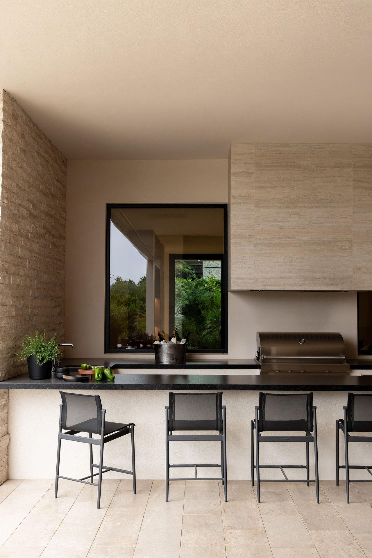 Modern luxury home in Paradise Valley with resort-style backyard, pool, fire feature, and contemporary architecture at sunset.