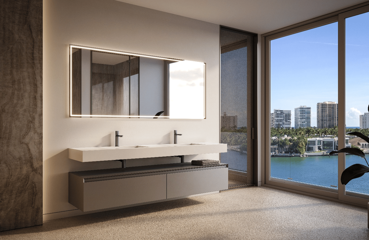 Modern double-vanity bathroom with an illuminated mirror and bay views through floor-to-ceiling windows.