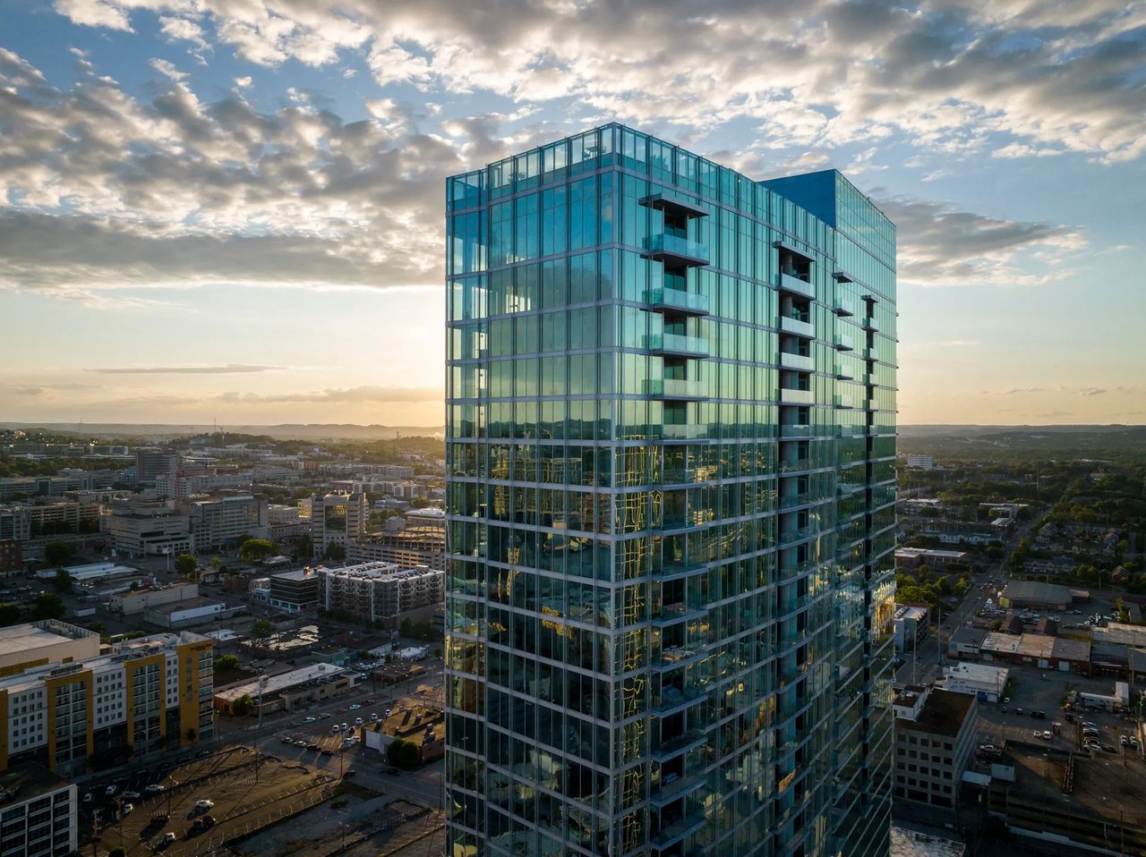 The Broadwest Residences luxury high-rise in downtown Nashville, modern architecture with glass facade.