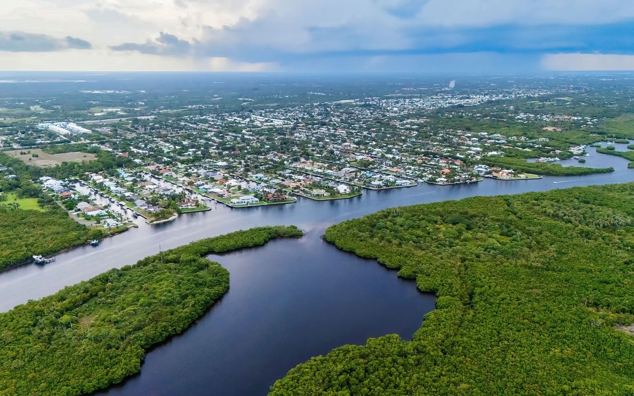 Aerial view of Hobe Sound homes and waterways surrounded by mangroves.