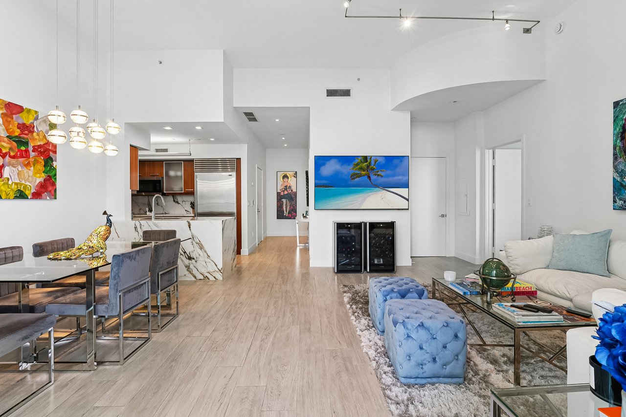 Open living and dining areas facing the refreshed kitchen in Jade at Brickell Bay Unit 611