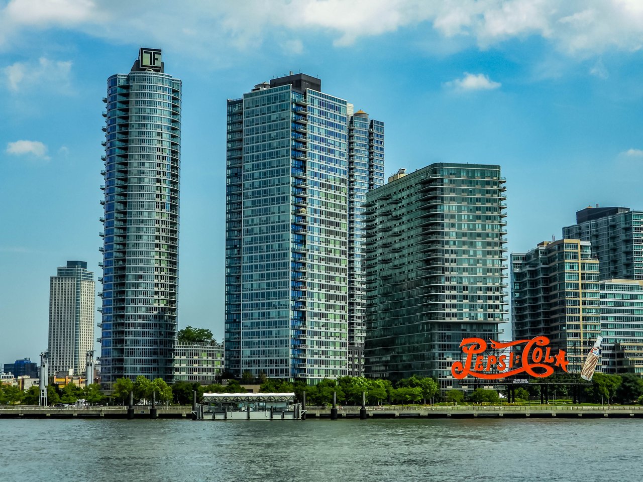 The Neighborly luxury condominium at 37-14 34th Street in Long Island City, Queens, featuring contemporary architecture, boutique residences, premium amenities, and modern design.