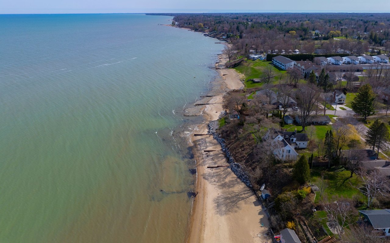 Aerial view of Lexington’s Lake Huron shoreline, with a sandy beach and waterfront homes.
