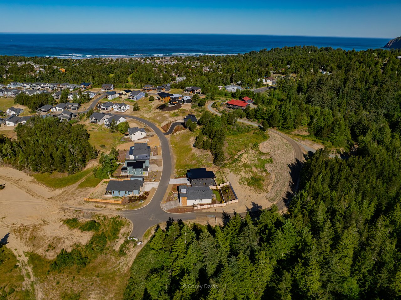 Sold new construction home at 476 Sea View Dr in Manzanita, Oregon, with buyer representation by Meadow Davis of Home + Sea Realty, featuring a daylight ranch layout, covered deck, and attached garage.
