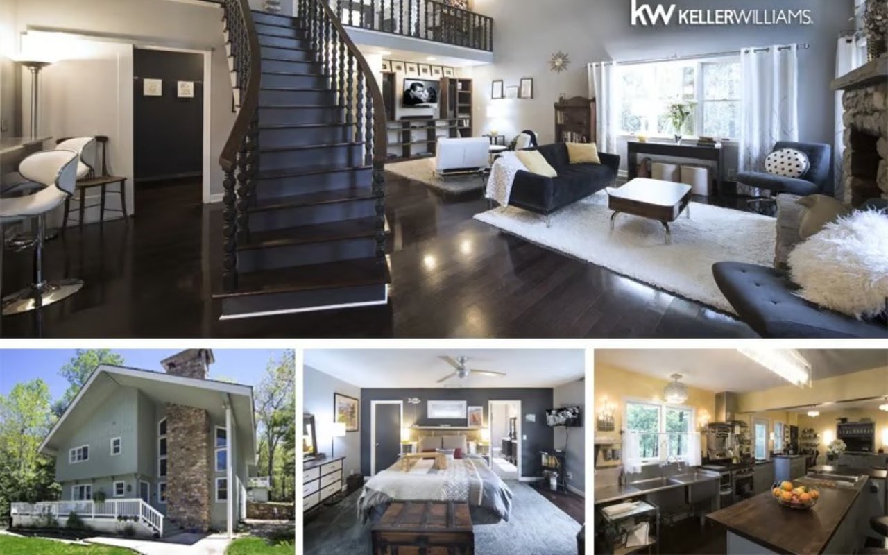 Contemporary mountain home with a sweeping dark staircase, open living area, and stone fireplace.