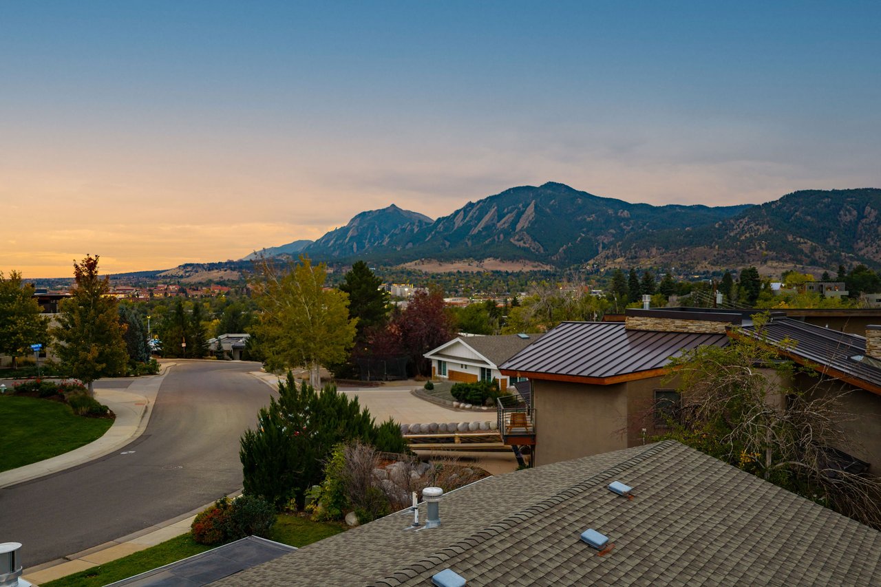 Twilight view south from the roof of 2003 Balsam Drive along the street to the Flatirons