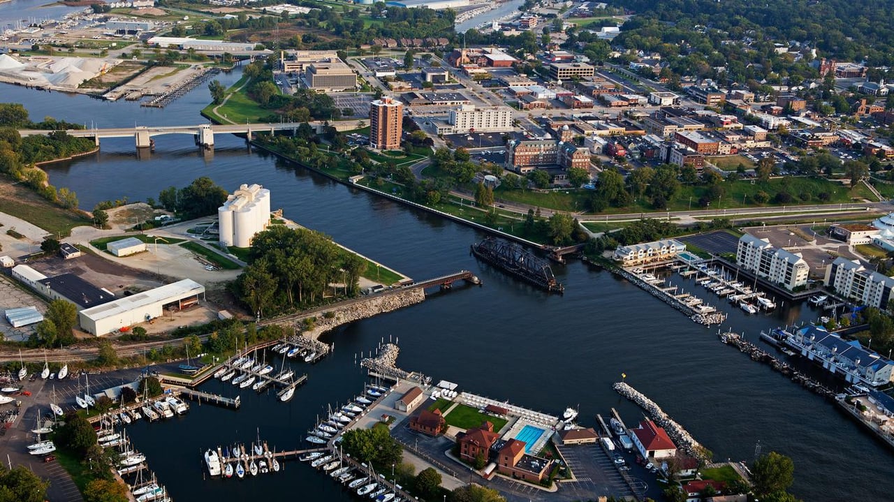 Aerial view of downtown Benton Harbor, Michigan with marina, river, and Lake Michigan shoreline.