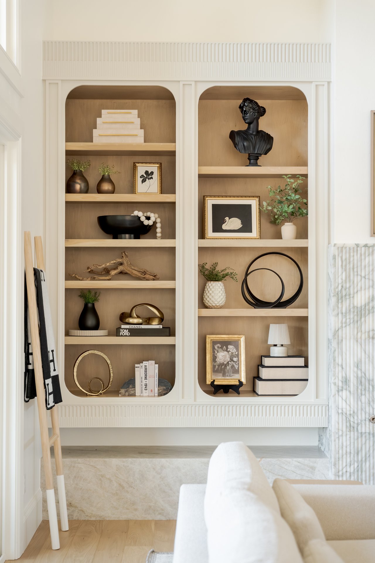 built-in shelving and fluted marble fireplace in Edmond luxury home