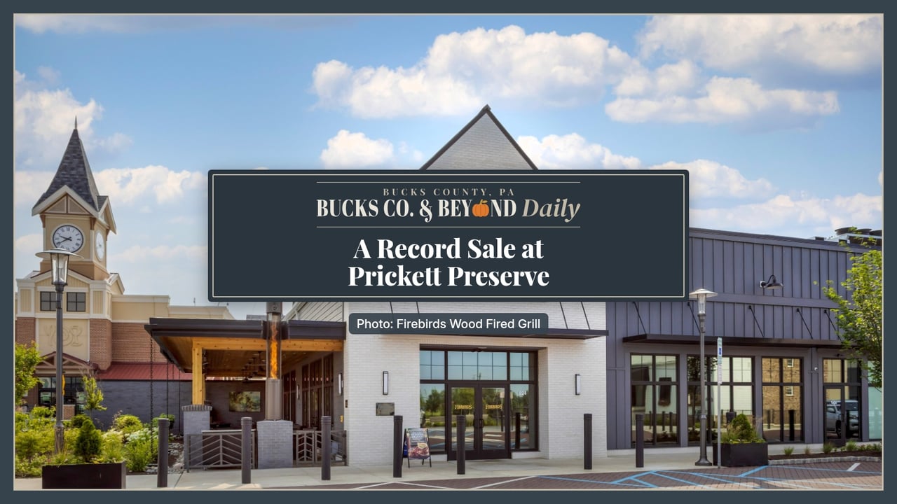 Bucks Co. & Beyond Daily: A Record Sale at Prickett Preserve. Exterior of Firebirds Wood Fired Grill at the Prickett Preserve shopping center in Lower Makefield, a white gabled building beside dark gray storefronts under a blue sky.