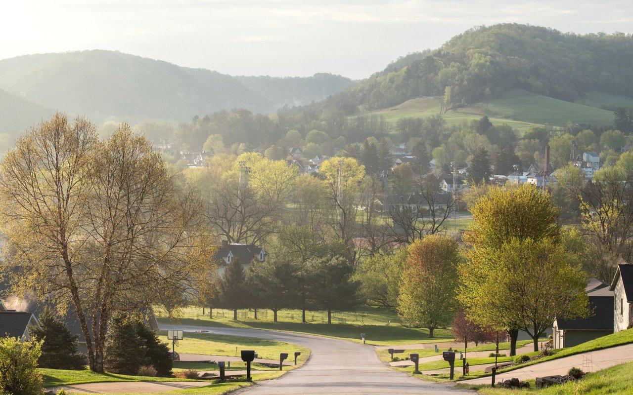 Scenic view of Vernon County, Wisconsin, showcasing rolling hills, lush greenery, and rural farmland in the Driftless Region, highlighting the natural beauty of the area.