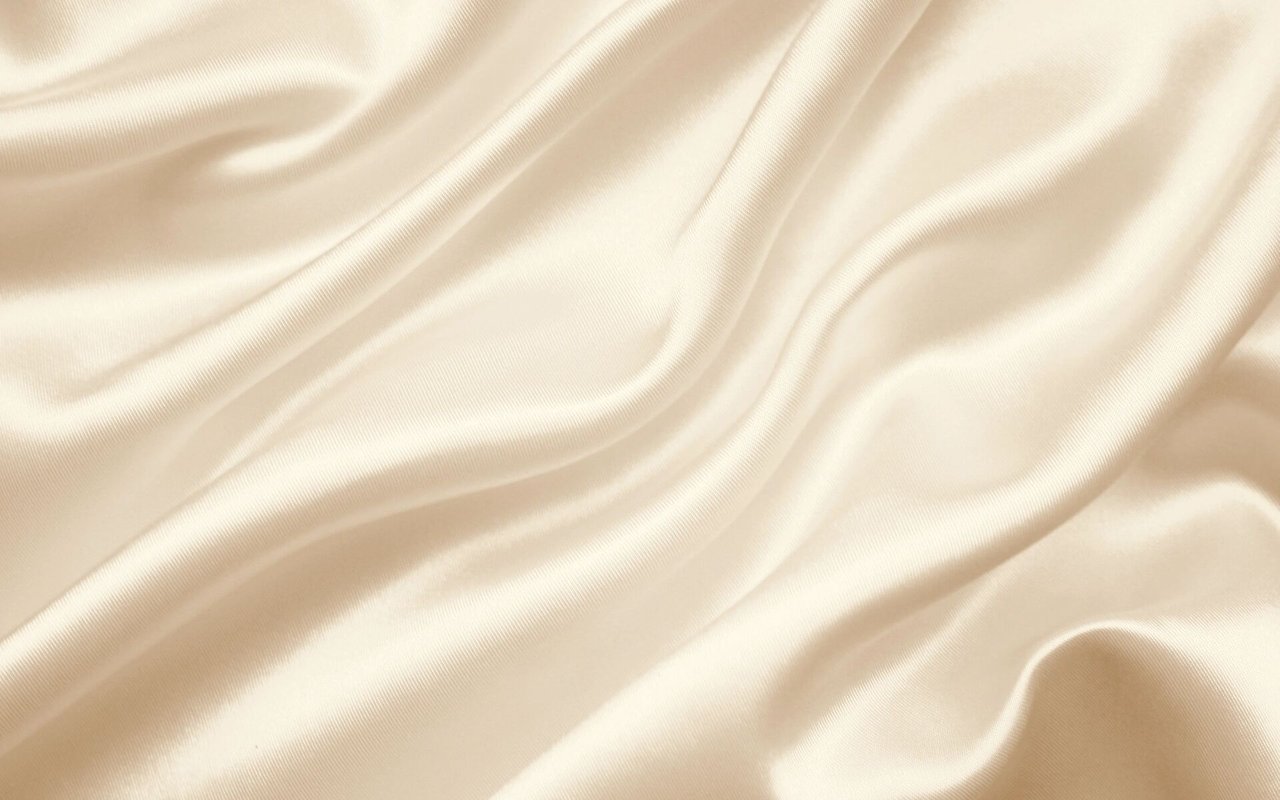 Ivory satin fabric draped in soft folds with a fine ribbed texture.