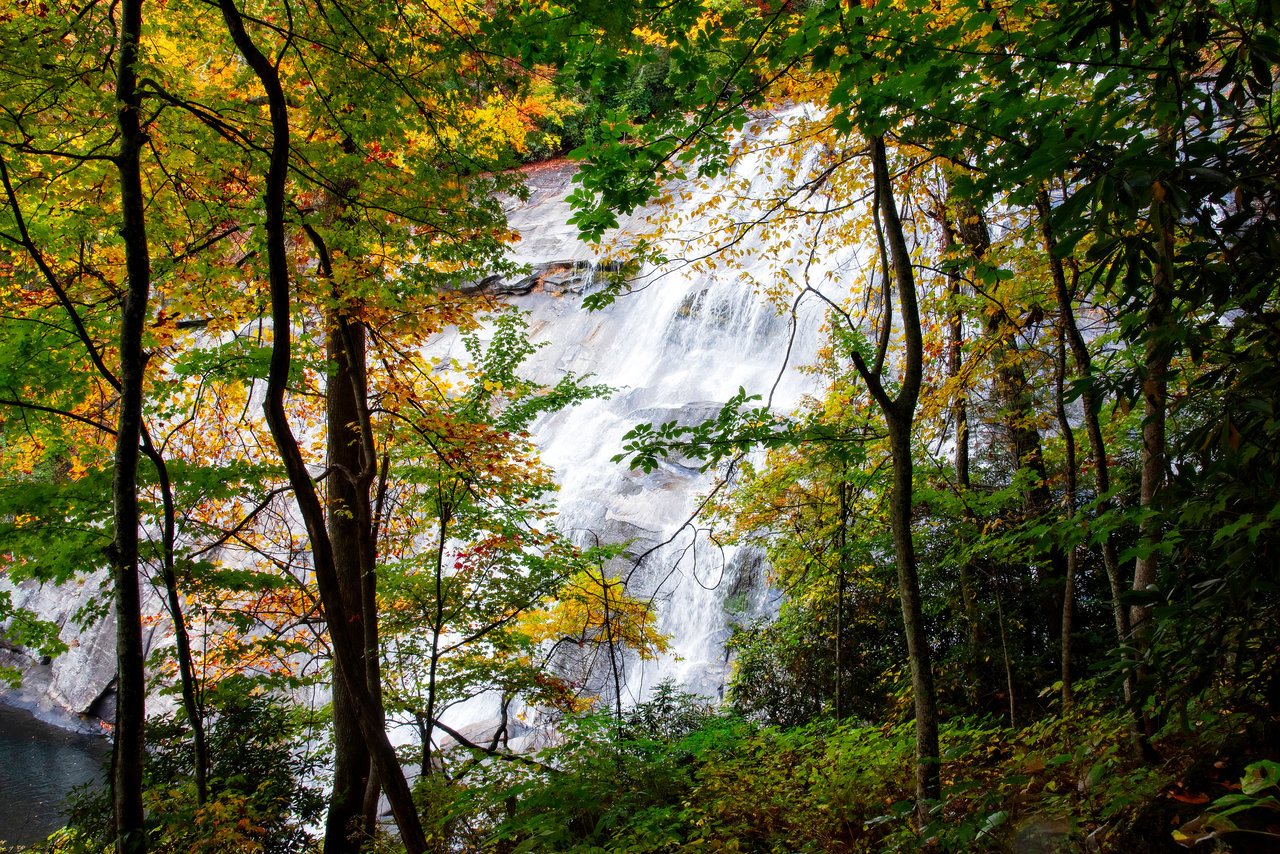 Waterfall cascading over granite through fall foliage near Cashiers NC