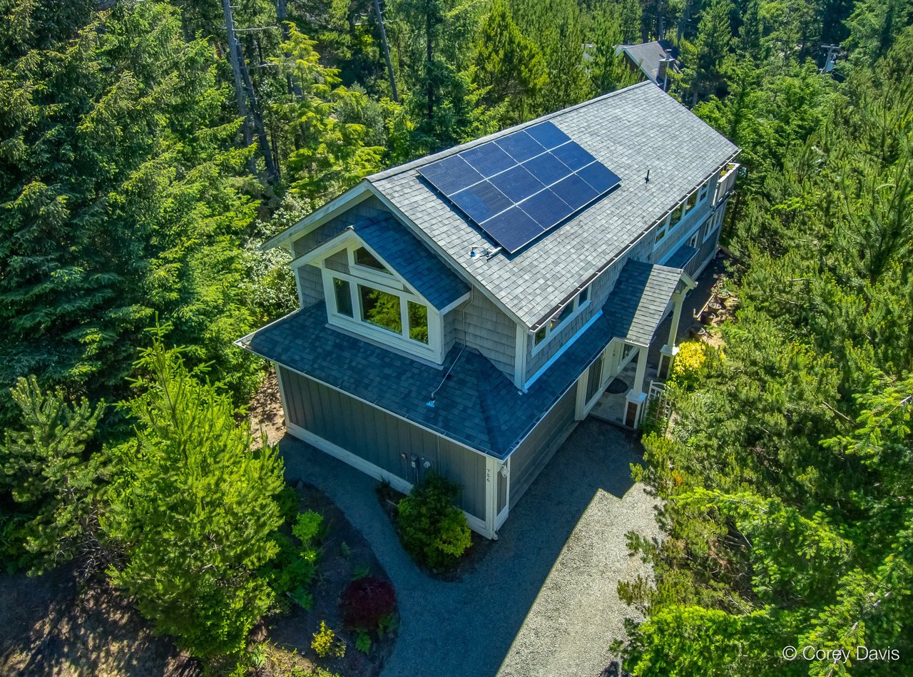 Sold Classic Ridge home at 756 Nutmeg St in Manzanita Oregon represented by Meadow Davis of Home + Sea Realty with treetop privacy and ocean peeks
