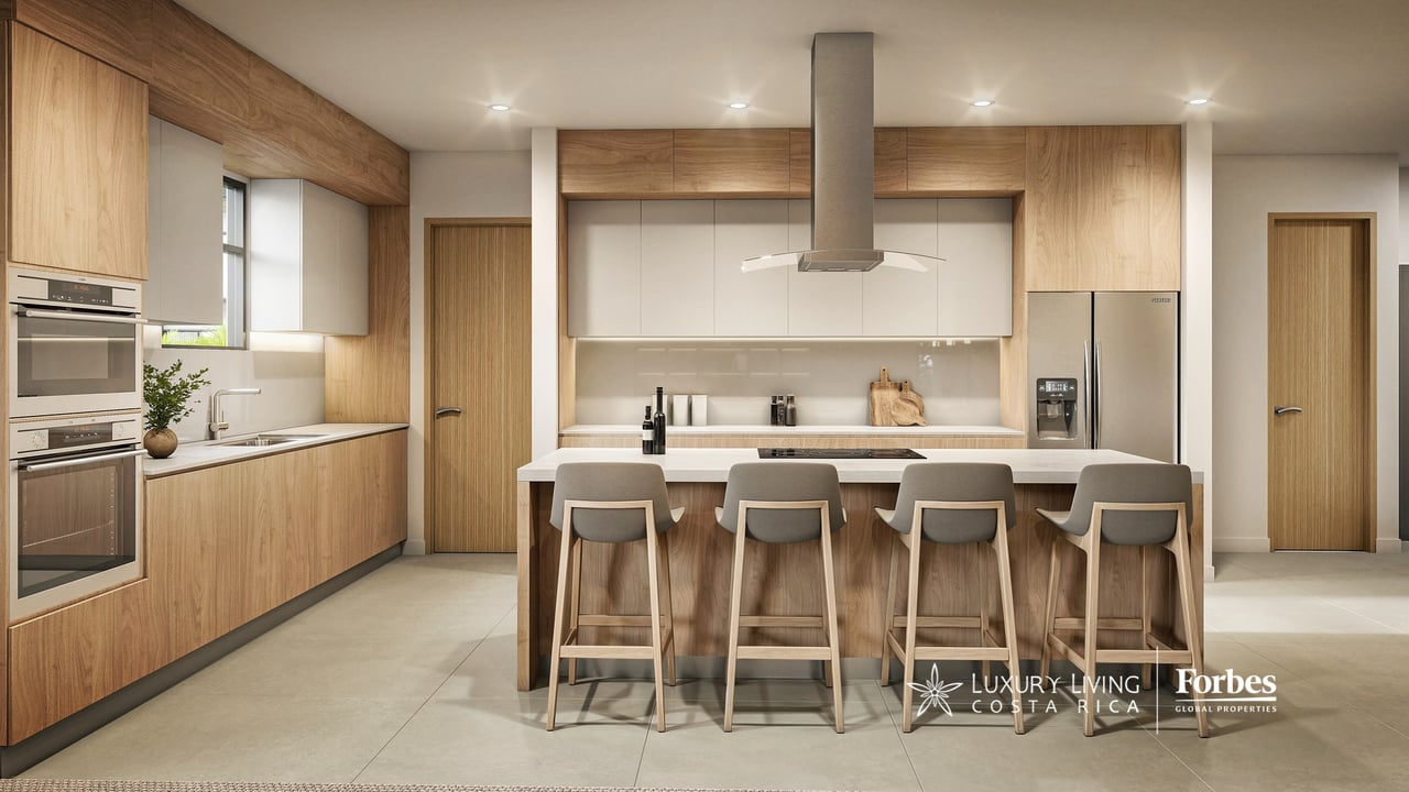 Modern kitchen with light wood cabinetry and a large island with four bar stools.