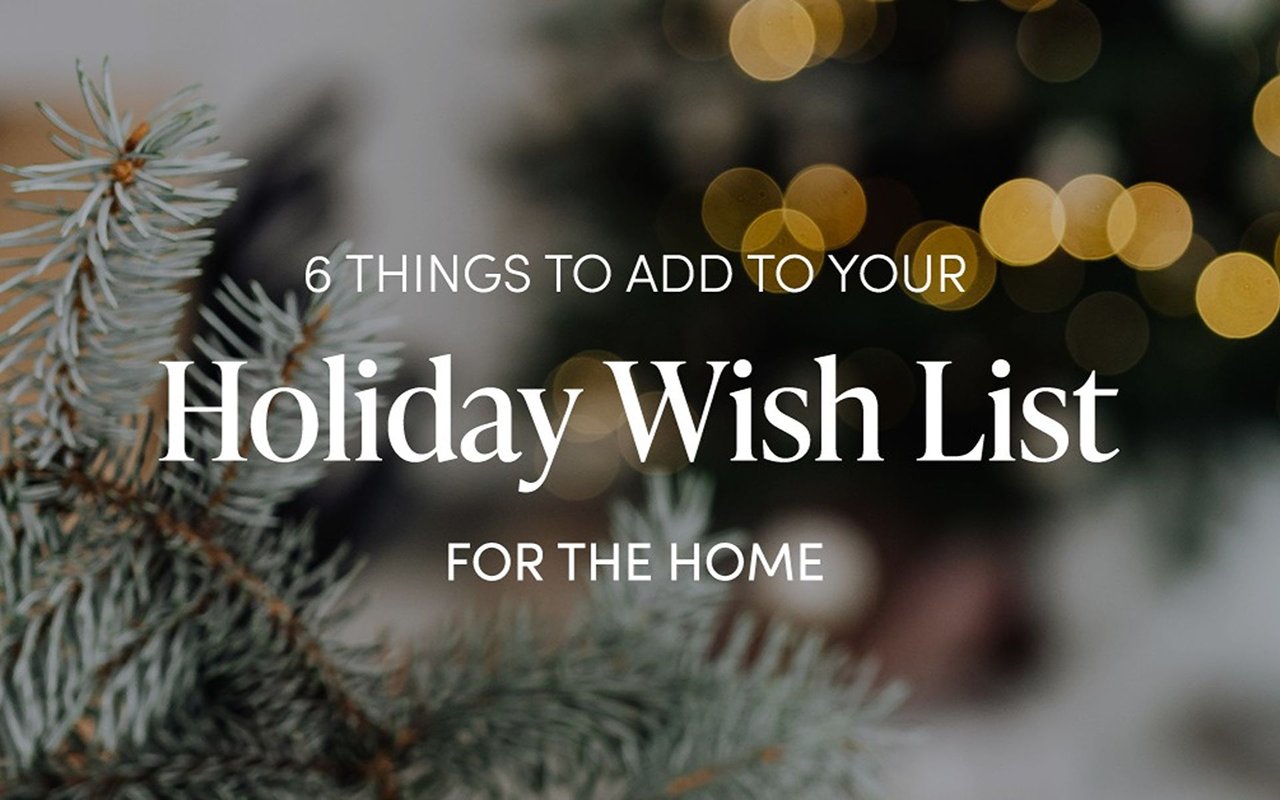 Holiday wish list for the home, over frosted evergreen branches and warm golden lights.