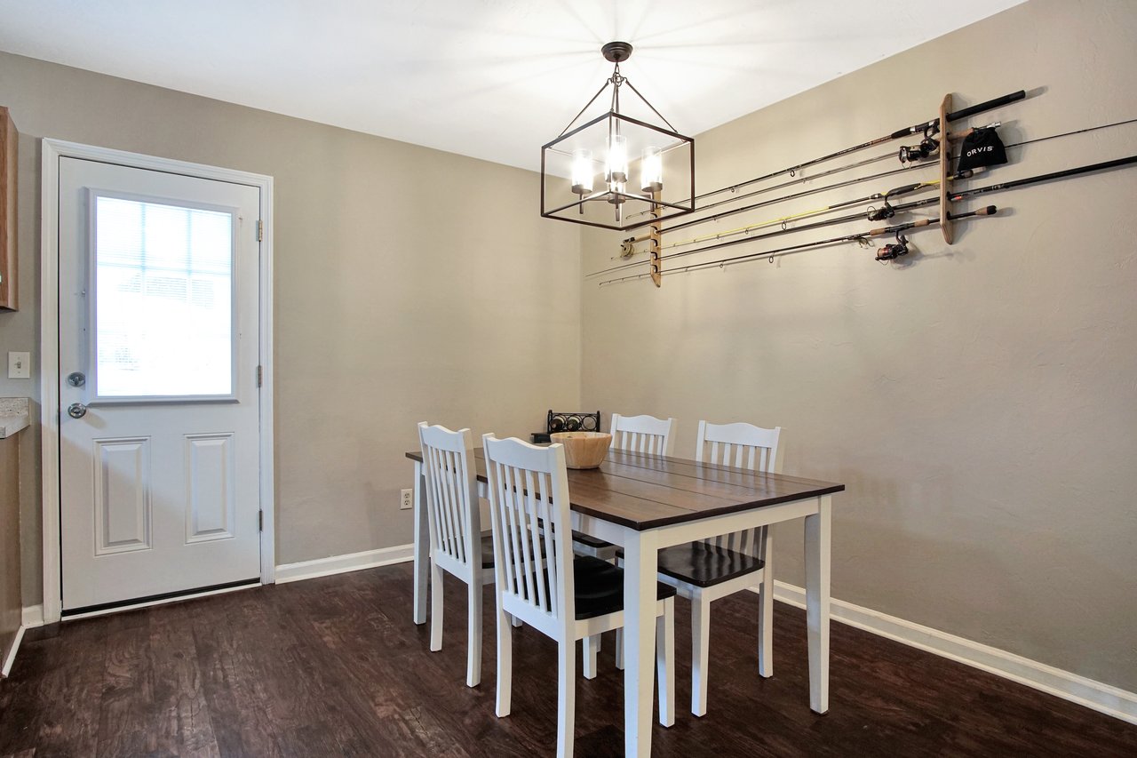 A dining room featuring a table surrounded by chairs, creating an inviting space for meals and gatherings.