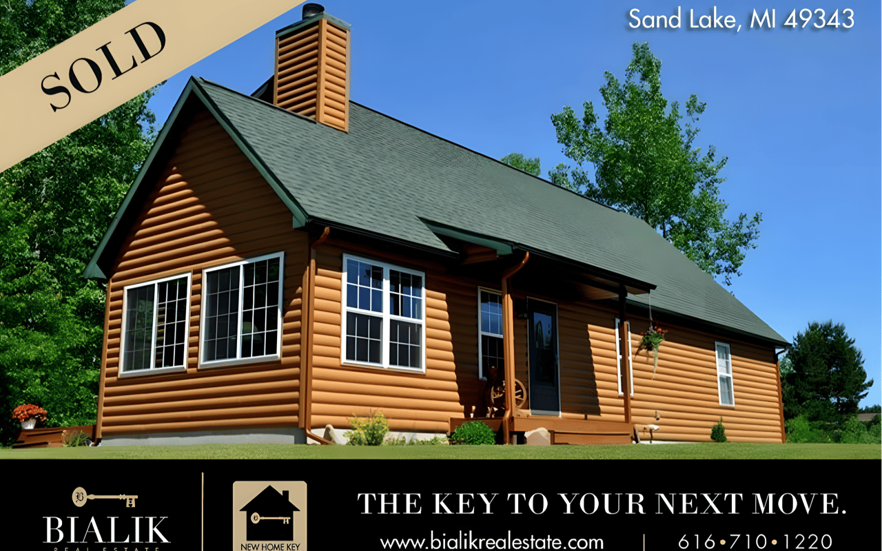 Log-sided home in Sand Lake, Michigan, marked sold.