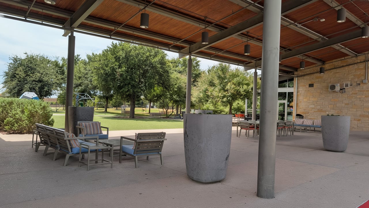 Outdoor patio space at he Windsong Ranch Clubhouse overlooking Cafe and play space.