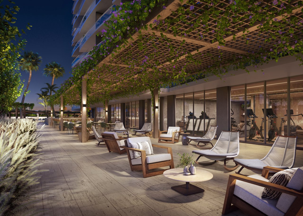 Residential terrace with lounge seating beneath a flowering pergola and a fitness room behind glass.