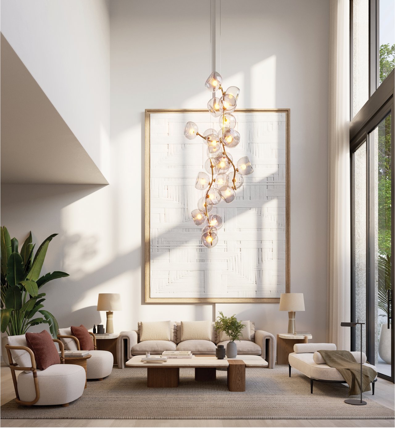 Living room with neutral seating, oversized framed artwork, glass pendant lights, and tall windows.