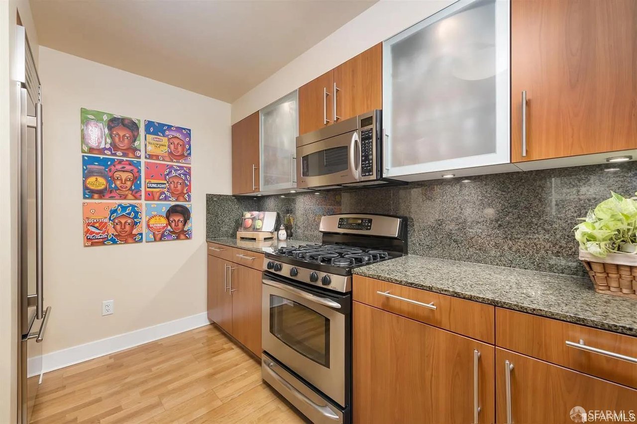 Modern kitchen with wood cabinets and stainless steel appliances