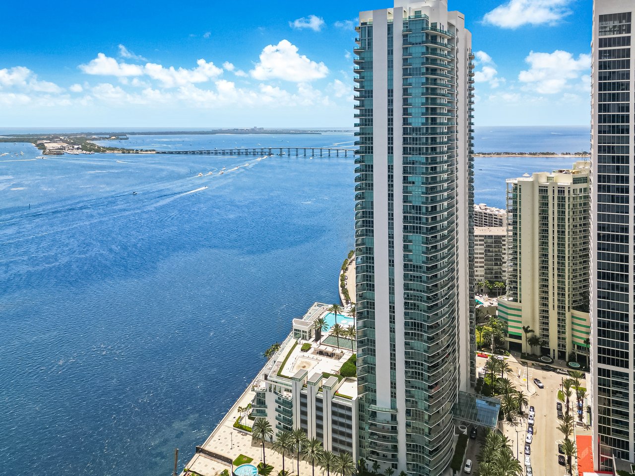 Aerial view of Jade Residences at Brickell Bay overlooking Biscayne Bay and the Brickell waterfront in Miami