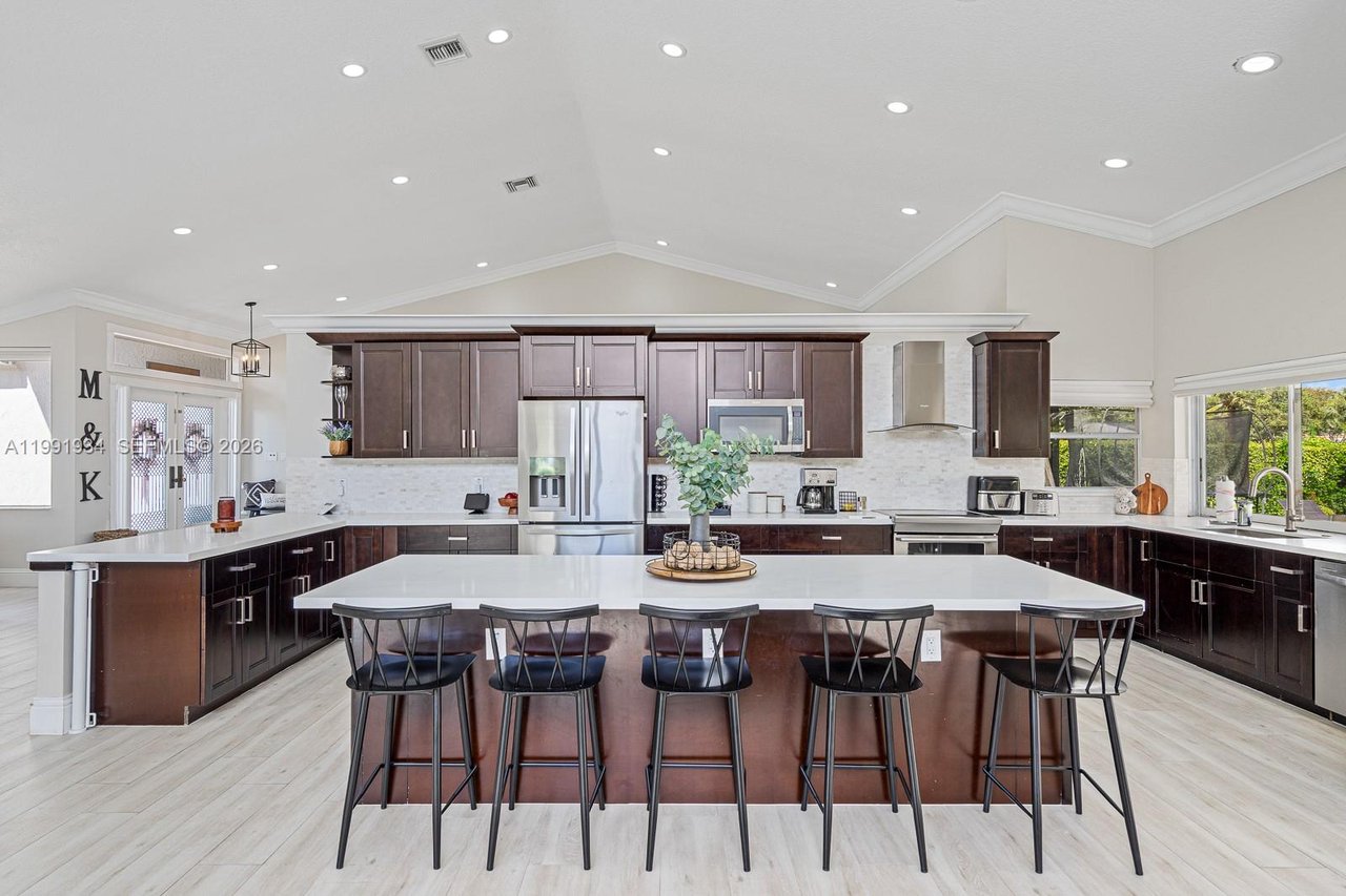 New To The Market: 8412 NW 52 Place, Coral Springs ​| Luxury Waterfront Pool Home in Pine Ridge For Sale