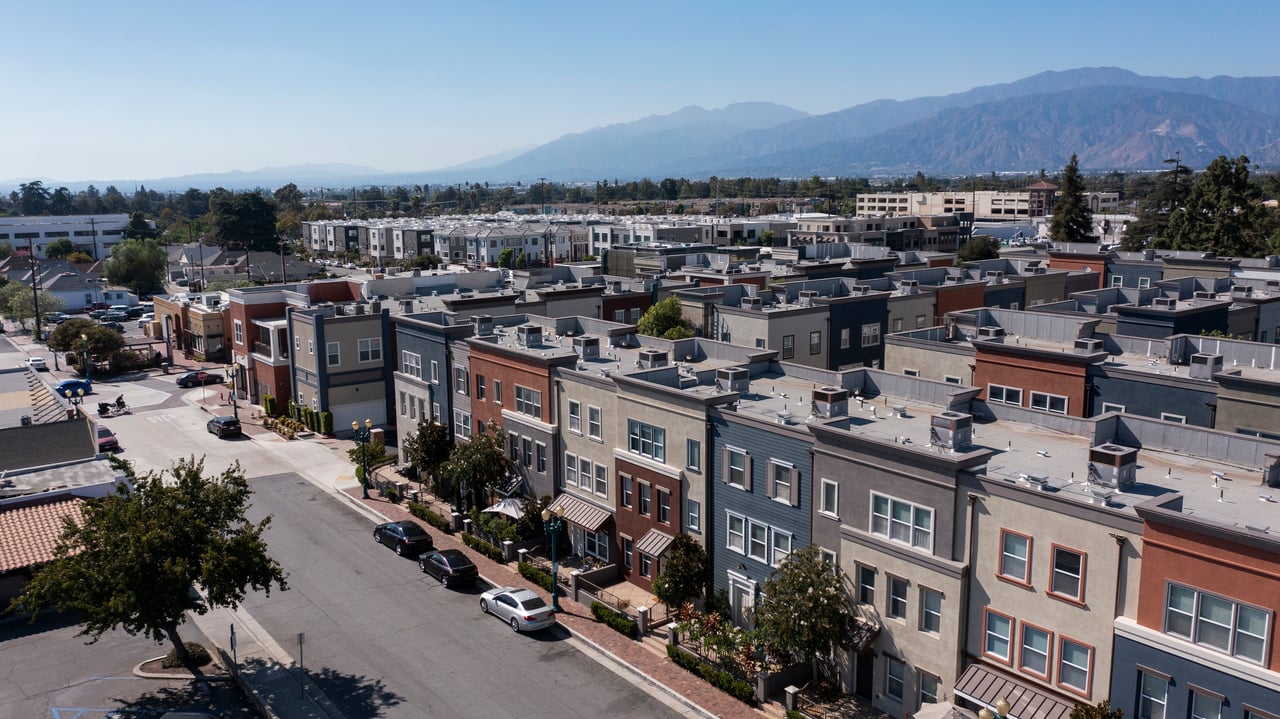 Aerial view of Covina townhomes with mountains in the distance.